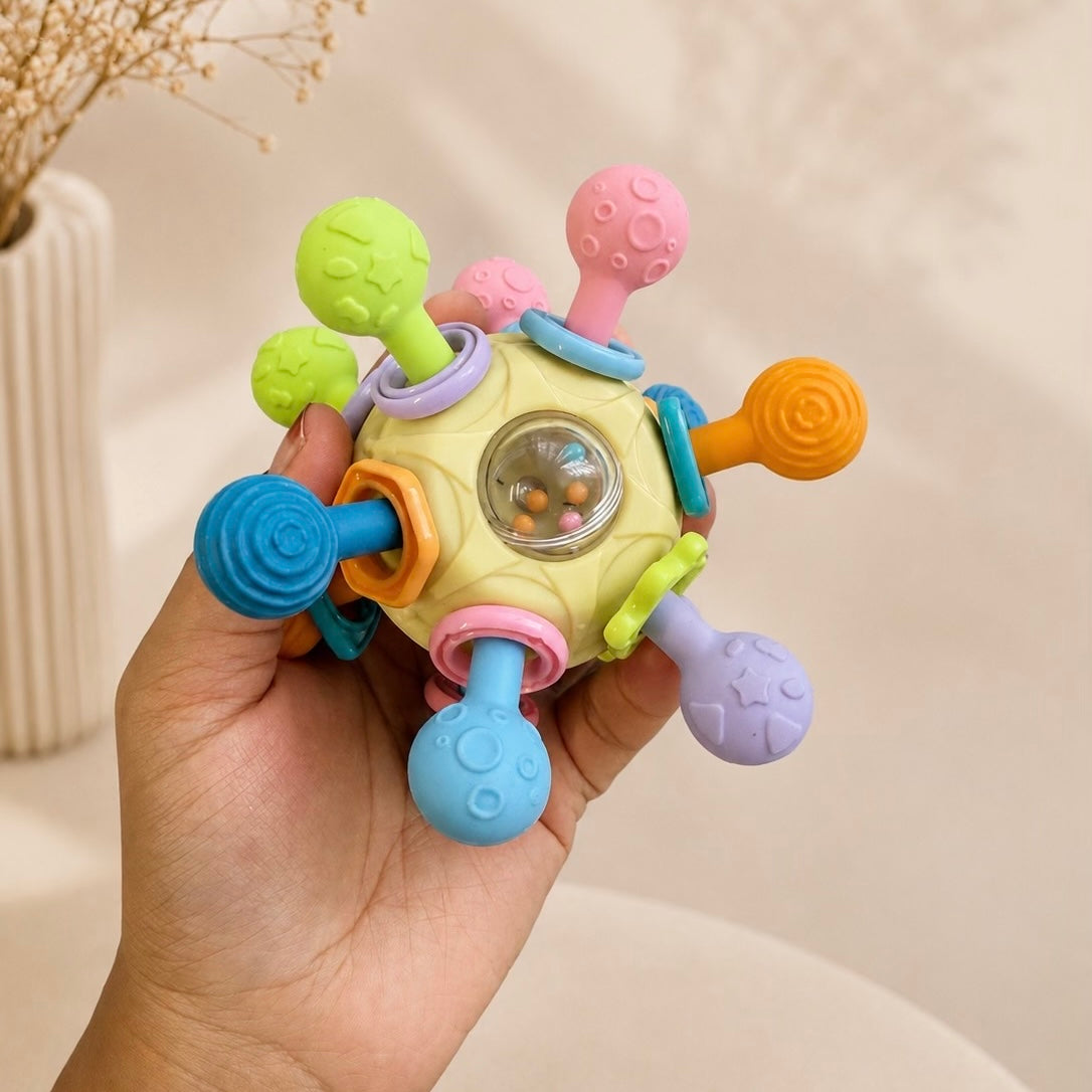 Atomic spinning teether ball