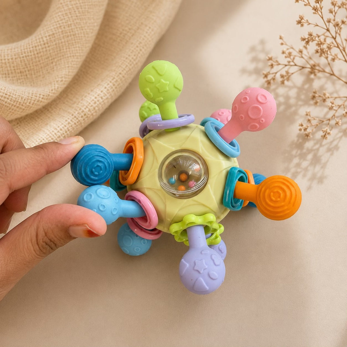 Atomic spinning teether ball